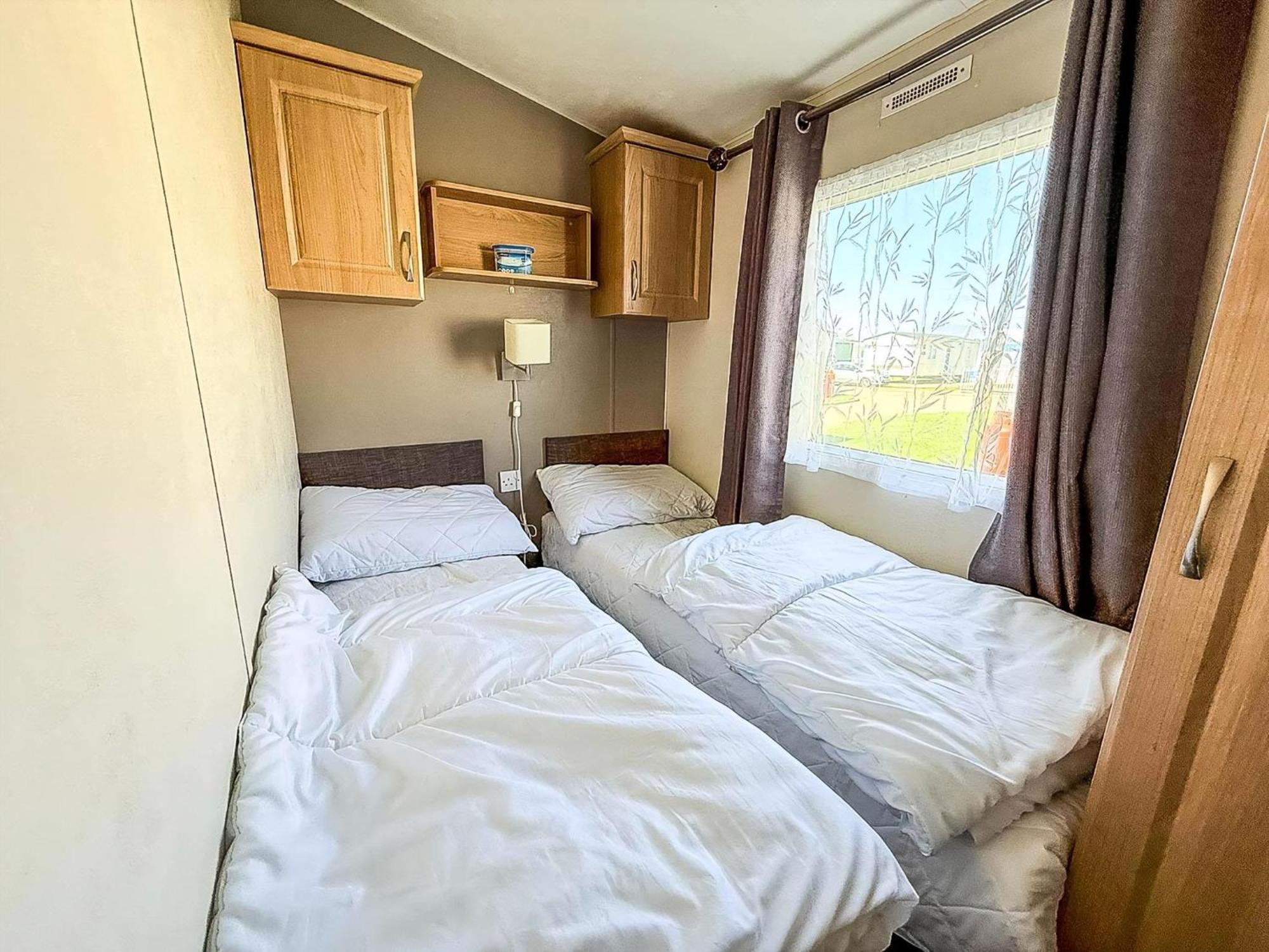 Lovely Caravan With Decking To The Side At California Cliffs Ref 50072d